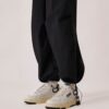 CLC Low Sneaker aus weißem Leder und schwarzem Wildleder