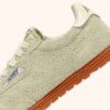 Sneaker Windspin aus butterweißem Wildleder